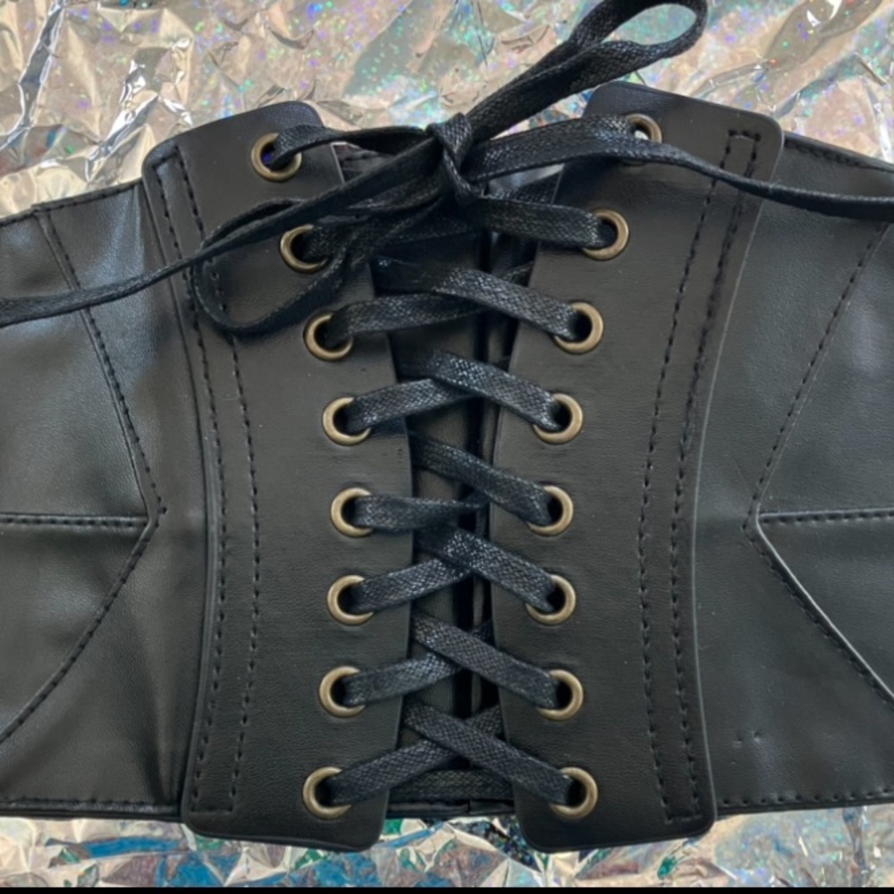 Spirit black faux leather corset belt a lace-up front and a snap-button closure